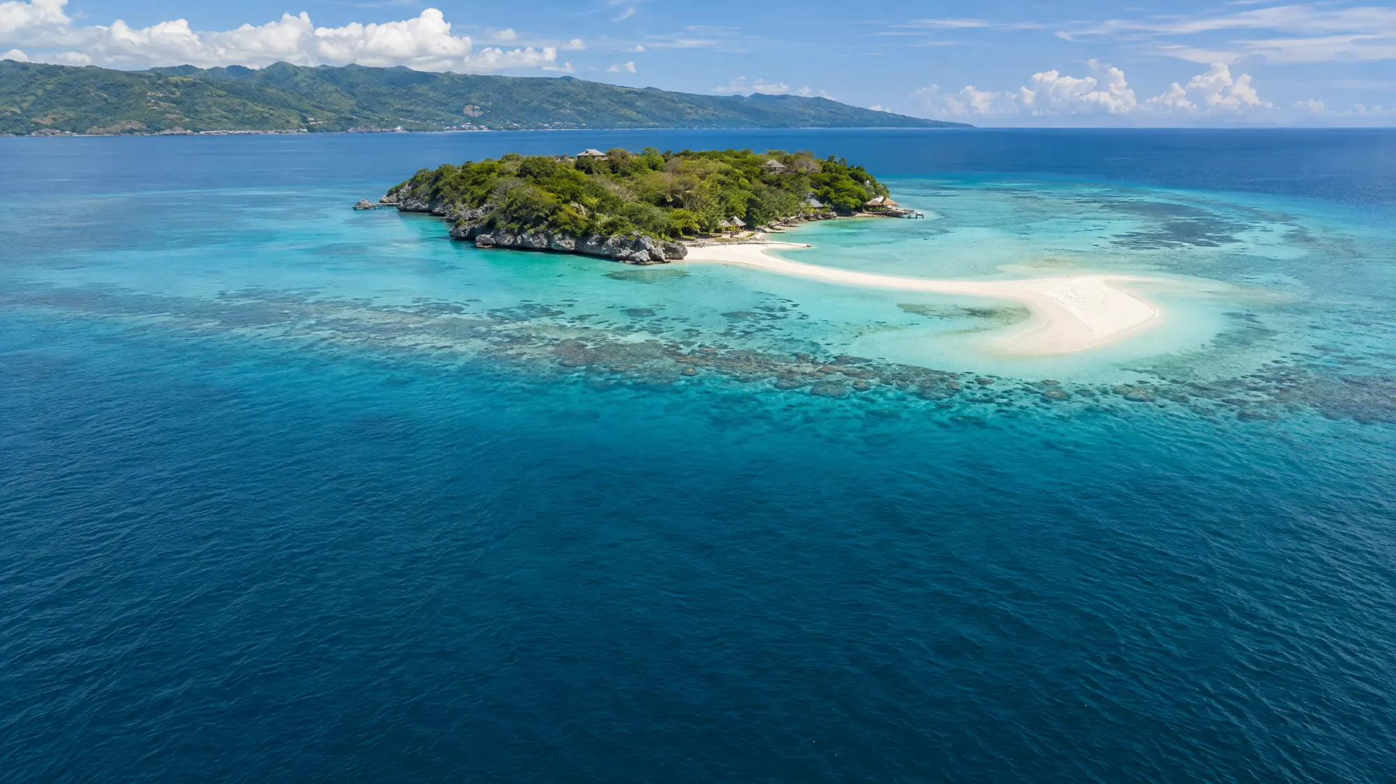 Explore a 24-hectare coral island known for its shifting white sandbar. It sits 15 minutes by boat from the Oslob mainland.